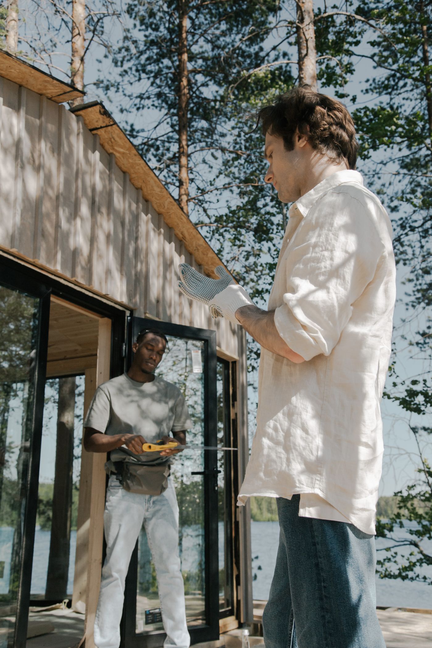 Professional workers actively building a wood outdoor structure